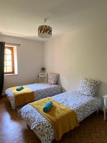 Postel nebo postele na pokoji v ubytování Moulin du château
