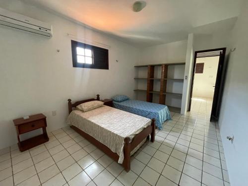 Postel nebo postele na pokoji v ubytování Porta Das Dunas Beach Hideaway