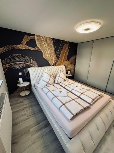 a bedroom with a large bed in a room at Rhein Appartements in Rheinhausen