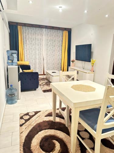 a living room with a table and a couch at Sealaview in Ukunda