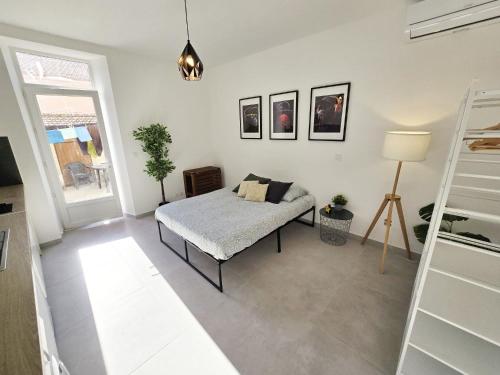 Ένα ή περισσότερα κρεβάτια σε δωμάτιο στο GregBnb - Studio 23m2 - Climatisé -10min Gare - 6