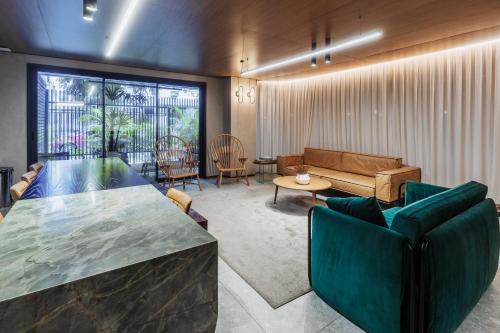a living room with a couch and a table at OBO Casa • Modern Lux Design Loft • Ipanema Beach in Rio de Janeiro