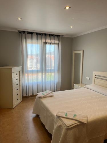 Postel nebo postele na pokoji v ubytování Vive Home Barrantes