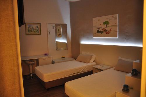 Letto o letti in una camera di Il Piccolo Principe B&B