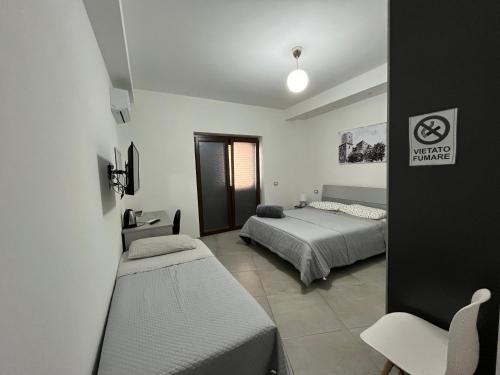 Posteľ alebo postele v izbe v ubytovaní A CASTA , come a casa tua