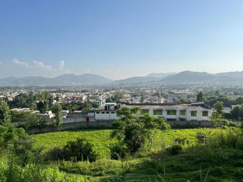 a view of a city from a hill at Areej heights in Abbottabad
