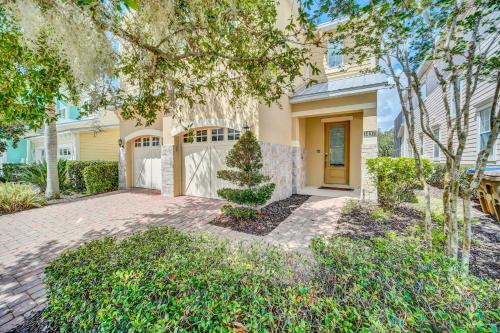 a house with a driveway and a garage at The Carpe Diem in Orlando