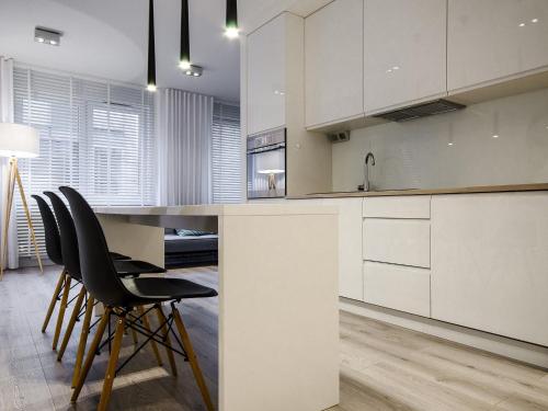 Η κουζίνα ή μικρή κουζίνα στο Ataner Apartamenty