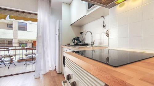 a kitchen with a sink and a counter top at Apartamento Fani Oro in Oropesa del Mar