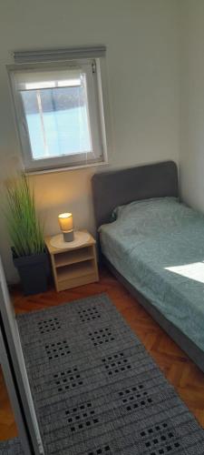 Postel nebo postele na pokoji v ubytování Apartman Vito
