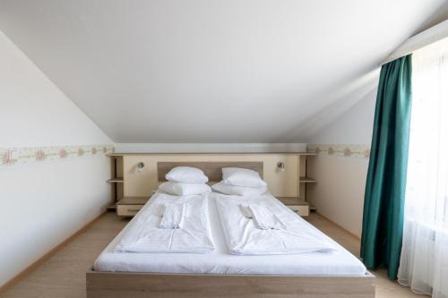 a bedroom with two beds in a attic at FarawayHomes Aparthotel Near Vienna Airport - Anytime Self Check-In in Bruck an der Leitha