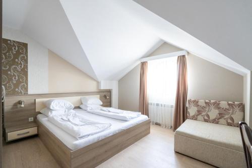 a hotel room with a bed and a window at FarawayHomes Aparthotel Near Vienna Airport - Anytime Self Check-In in Bruck an der Leitha