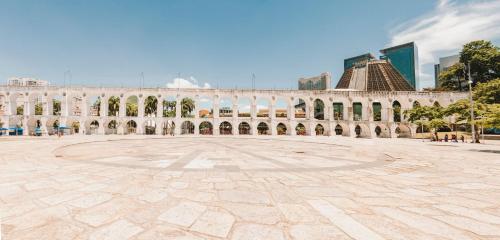 a large building with a large courtyard in a city at OBO Casa • Modern Lux Design Loft • Ipanema Beach in Rio de Janeiro