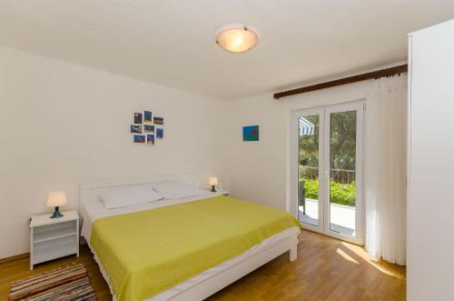 En eller flere senge i et værelse på Apartments Nedeljko