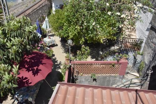 an overhead view of a garden with a bench and plants at Holiday Home Gionny & Mary in Taormina