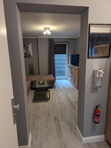 a living room with a couch and a table at Stadtnah an der Förde 7 HH M EG in Flensburg