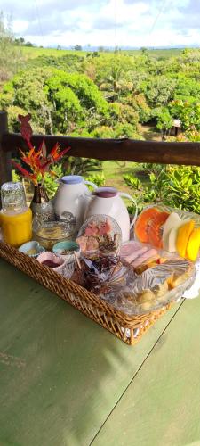 a tray of food on a table on a table at Vale do Lago - Casa de Campo e Eventos in Vila Velha