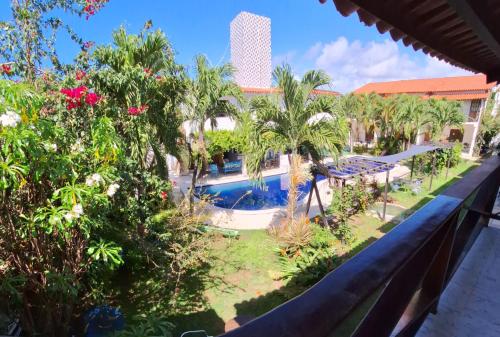 a view of the pool from the balcony at Falésias de Carapibus - Casa de temporada 06 - Jacumã in Conde
