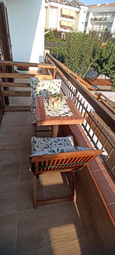 a balcony with two picnic tables on a roof at Regina di Puglia in Santeramo in Colle