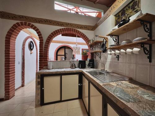 Kuchyň nebo kuchyňský kout v ubytování Casa Amaru