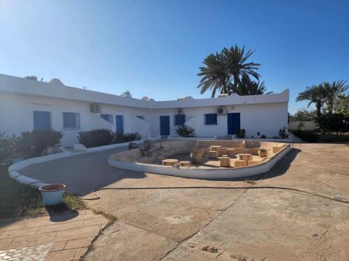 a boat parked in front of a building at Appartement Djerba, séjour in Djerba