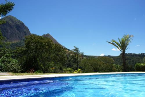 A piscina localizada em Pousada Recanto das Araras ou nos arredores