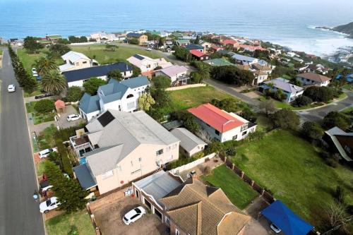 an aerial view of a small town next to the ocean at Vibe Beach House in Herolds Bay