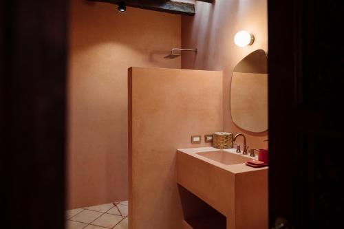 a bathroom with a sink and a mirror at Maison Mexique Hotel Boutique San Miguel de Allende in San Miguel de Allende