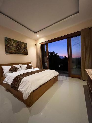 Ένα ή περισσότερα κρεβάτια σε δωμάτιο στο Lekok House Bali