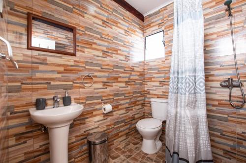 a bathroom with a sink and a toilet at Hostal Belen in San Pedro de Atacama