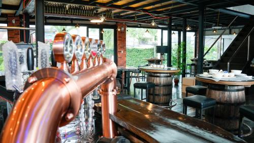 a bar with a row of wine barrels in a restaurant at Bavarian Guest House in Angeles