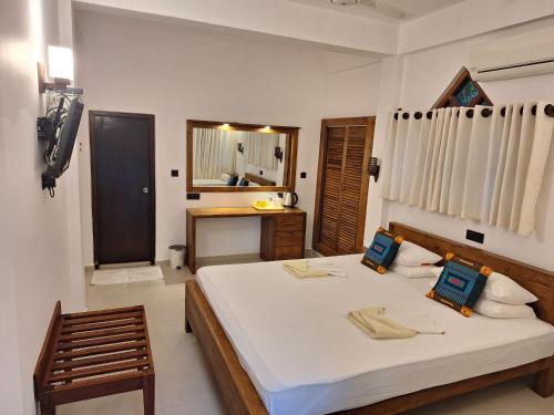Katil atau katil-katil dalam bilik di Villa Goodwill Paradise
