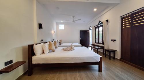 Katil atau katil-katil dalam bilik di Villa Goodwill Paradise