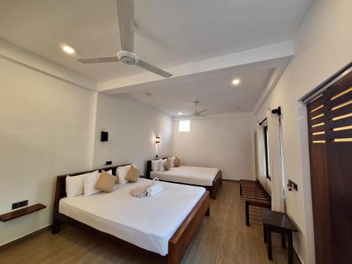 Katil atau katil-katil dalam bilik di Villa Goodwill Paradise