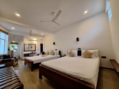 Katil atau katil-katil dalam bilik di Villa Goodwill Paradise