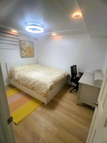 a bedroom with a bed and a desk and a desk at Millpond Basement Units in Richmond Hill