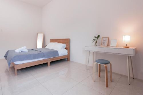 Voodi või voodid majutusasutuse Taiping Homestay 5R3B, 9mins - Zoo & Lake Garden Taiping toas