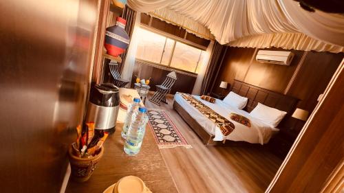 a small bedroom with a bed and a window at Rum rose luxury camp in Wadi Rum