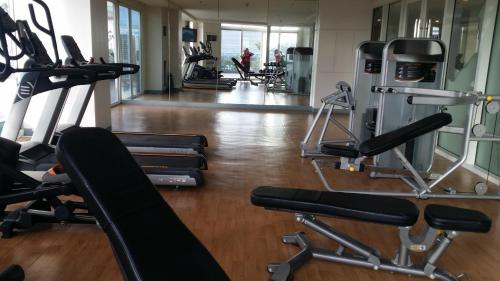 a gym with several treadmills and cardio machines at megaworld iloilo city, one madison luxury residences in Iloilo City
