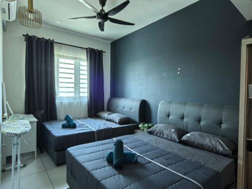 Ένα ή περισσότερα κρεβάτια σε δωμάτιο στο Sweet Homestay Meritus by Moowin