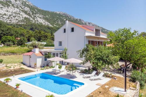 an image of a villa with a swimming pool at Villa Knez in Gata