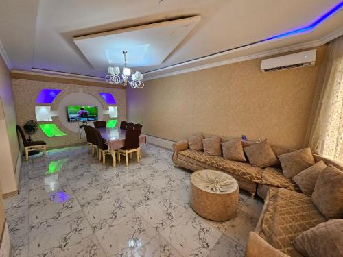 a living room with a couch and a dining room at Villa RML Montainside CYHN in Gabala