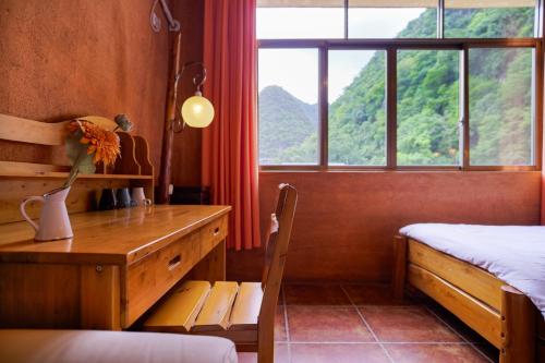 Cama o camas de una habitación en YangShuo Eden Inn