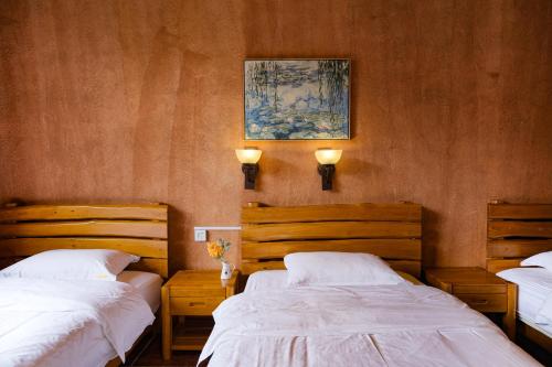 Cama o camas de una habitación en YangShuo Eden Inn