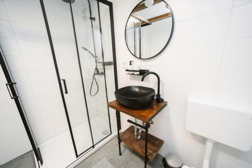 a bathroom with a sink and a mirror at Cozy Alpine House in Gozd Martuljek
