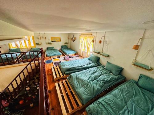 Postel nebo postele na pokoji v ubytování Ở Mô Dalat