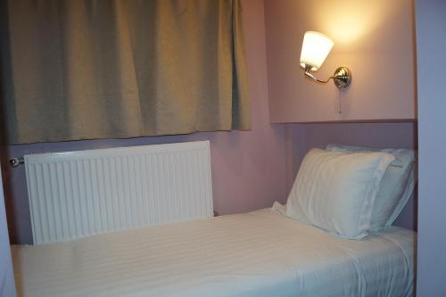 Krevet ili kreveti u jedinici u okviru objekta EU Guesthouse