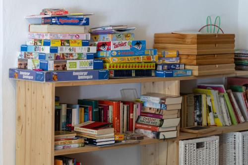a book shelf filled with lots of books at Chesa-strimer - Stüva Sur in La Punt-Chamues-ch
