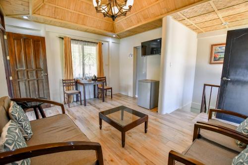 a living room with a couch and a table at Casa Basilisa Hotel & Resort in Guinobatan