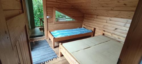 Postel nebo postele na pokoji v ubytování RNK Peebu Kämping